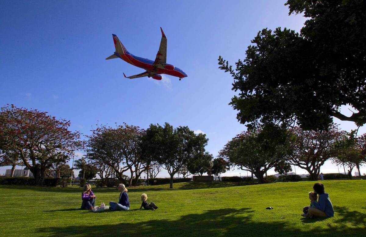 A plane prepares to land on the northermost runway at Los Angeles International Airport near Sepulveda Boulevard. Area residents oppose a plan to move the runway closer to residential neighborhoods.