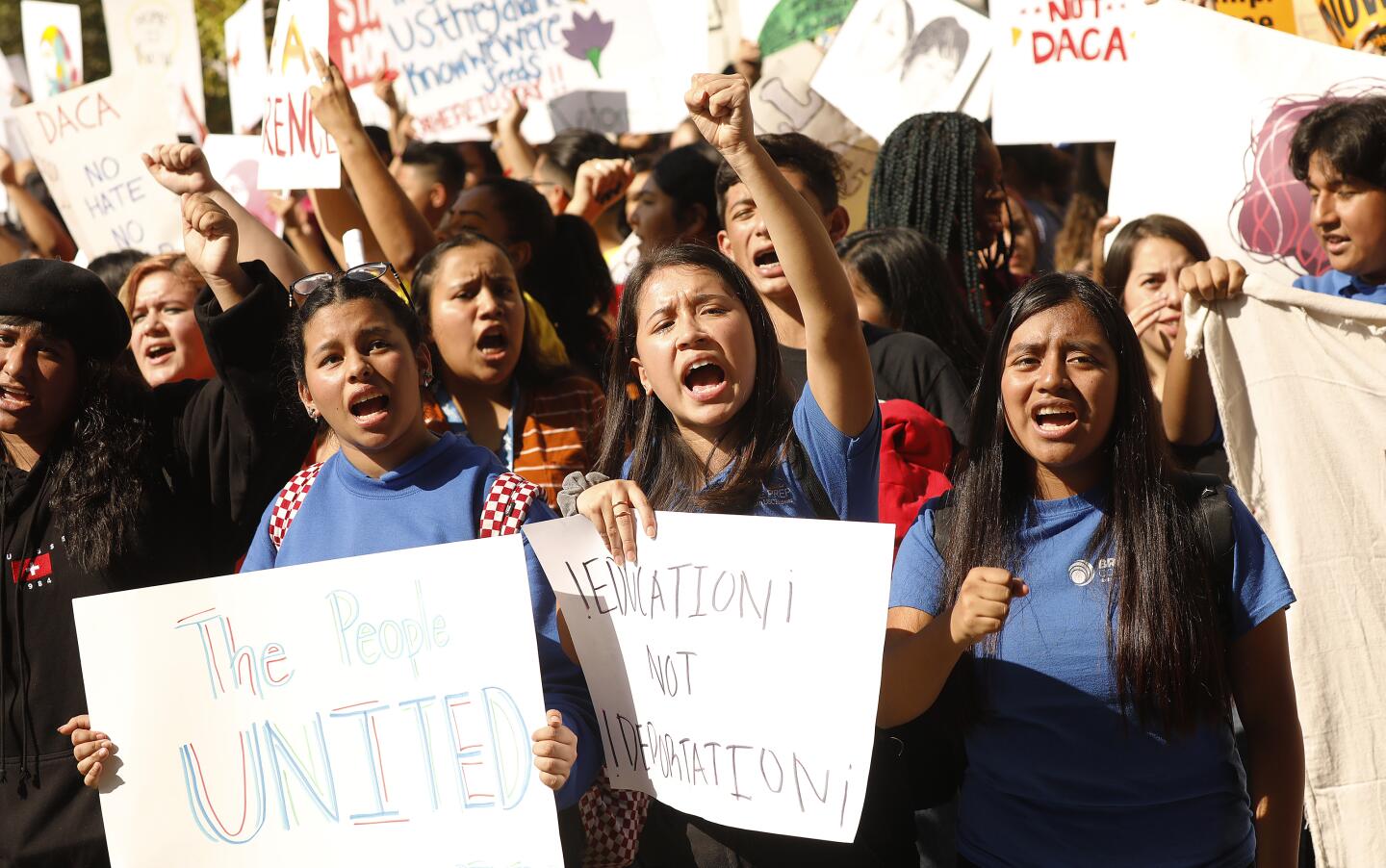 Protesters including, from left, Jennifer Aguilar, Desiree Plascencia and Daira Pena, students at Brio College Prep in L.A., join the downtown rally.