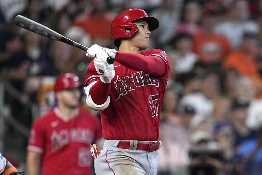 Los Angeles Angels' Shohei Ohtani (17) hits an RBI triple against the Houston Astros.