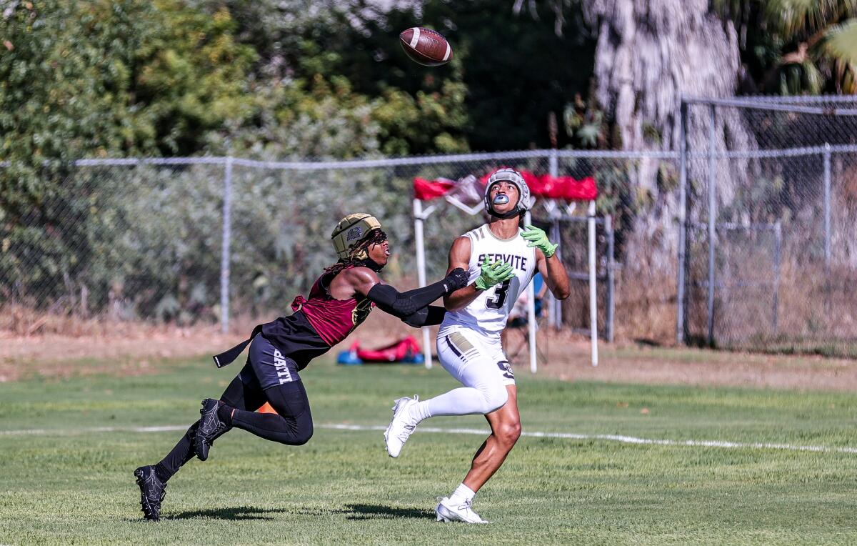 Devan Parker of Servite catches a touchdown pass against Oaks Christian at Mission Viejo on Saturday.