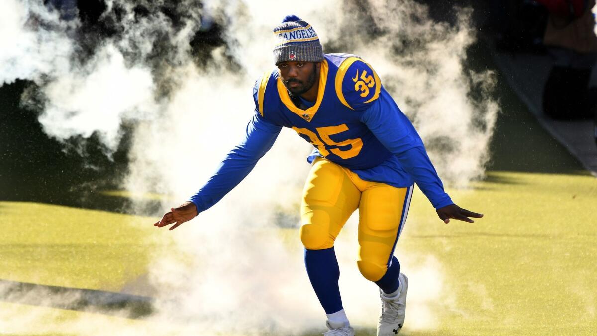C.J. Anderson is introduced before a game against the San Francisco 49ers at the Coliseum on Dec. 30, 2019.