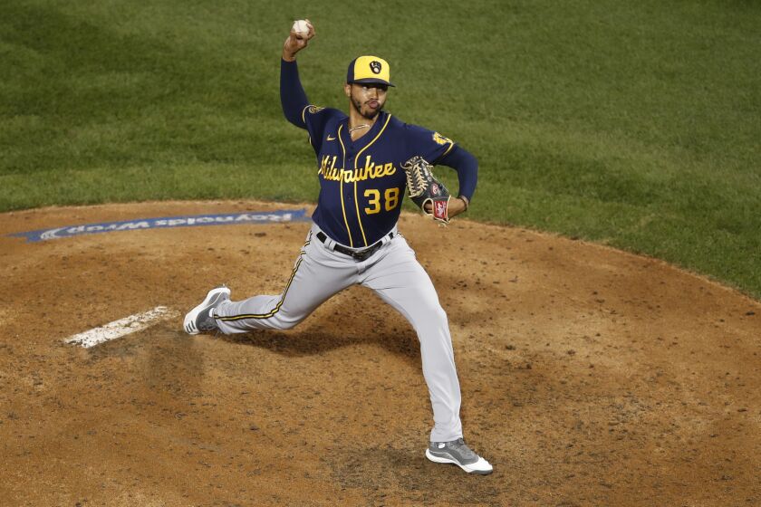 Milwaukee Brewers relief pitcher Devin Williams (38) delivers during a baseball game against the Chicago Cubs Friday, Aug. 14, 2020, in Chicago. (AP Photo/Jeff Haynes)