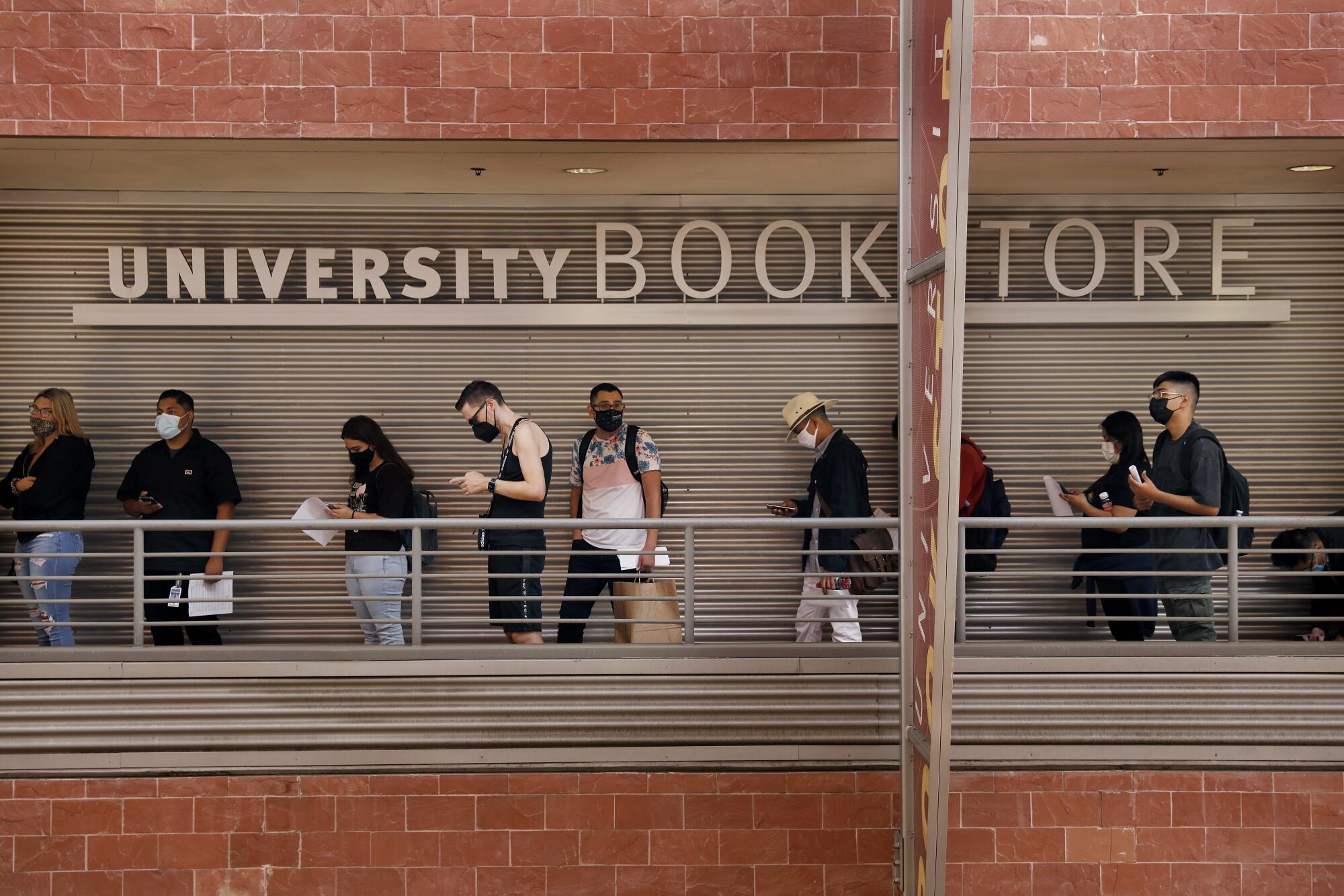 Students line-up outside the bookstore at Cal State L.A. as in-person instruction resumed.
