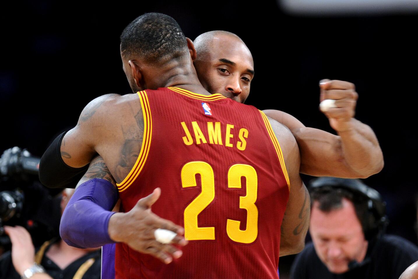 Lakers forward Kobe Bryant and Cavaliers forward LeBron James embrace each other before the start of the game on March 10 at the Staples Center.