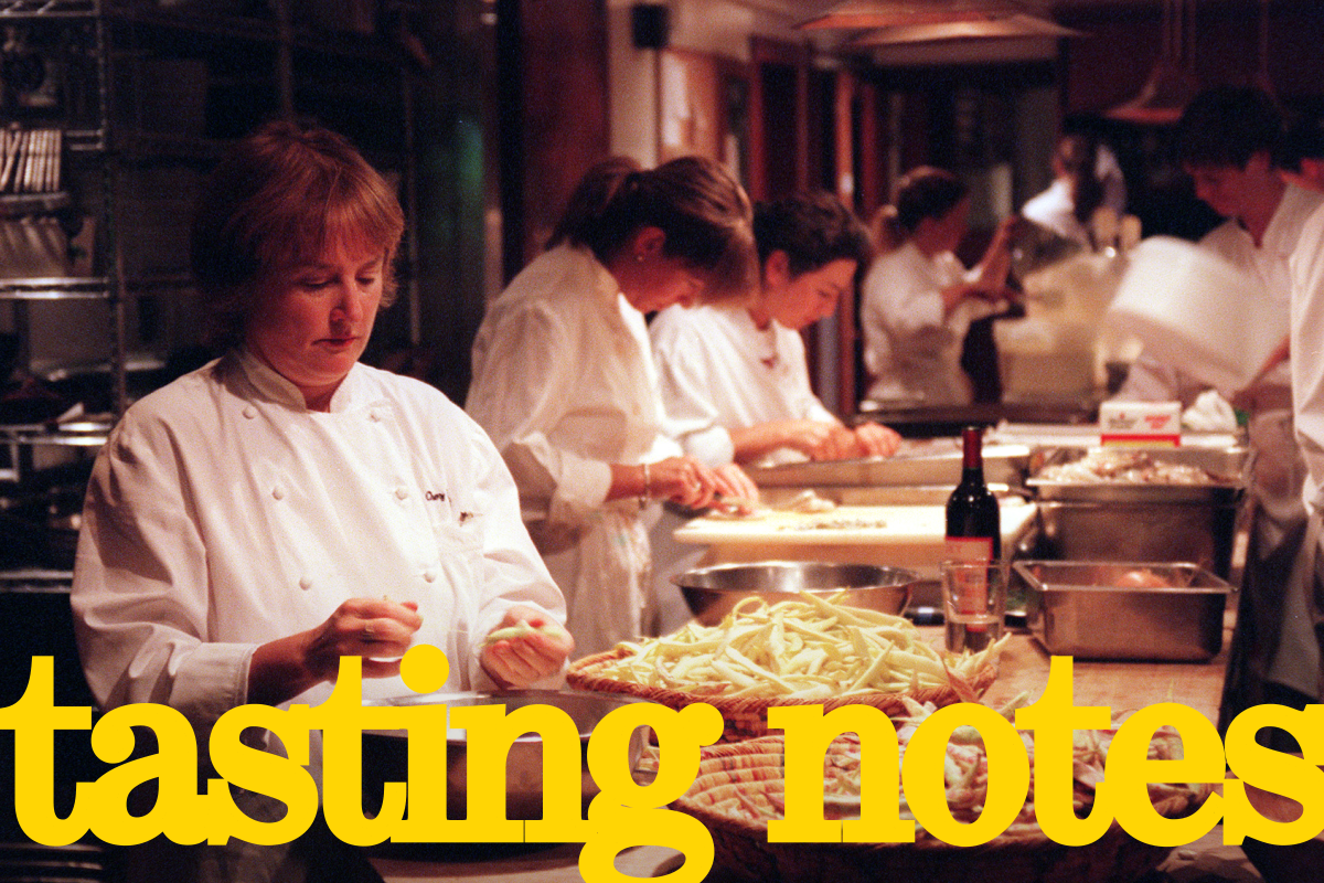 A photo with the words "tasting notes" on it shows people work in a kitchen.