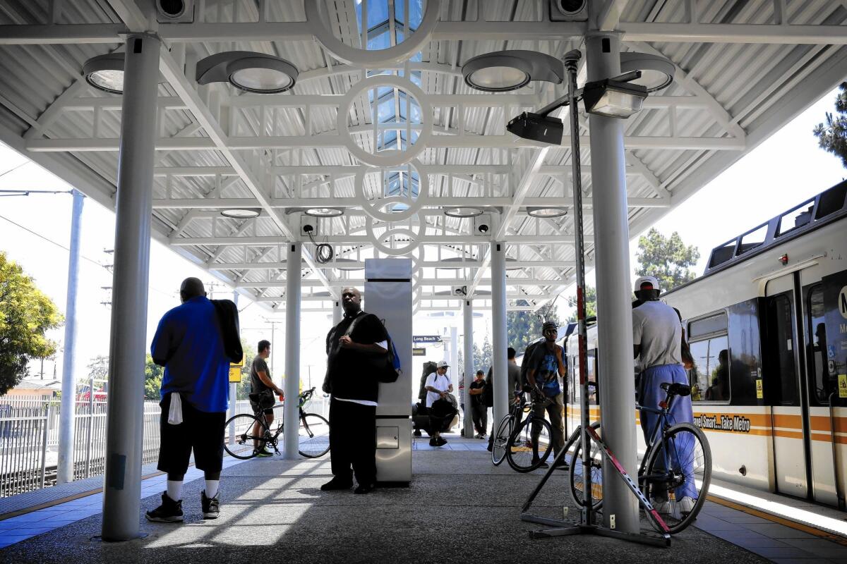 Commuters wait at Metro's Rosa Parks Station, built 25 years ago, at Imperial Highway and South Wilmington Avenue in what is now a predominantly low-income Latino community.