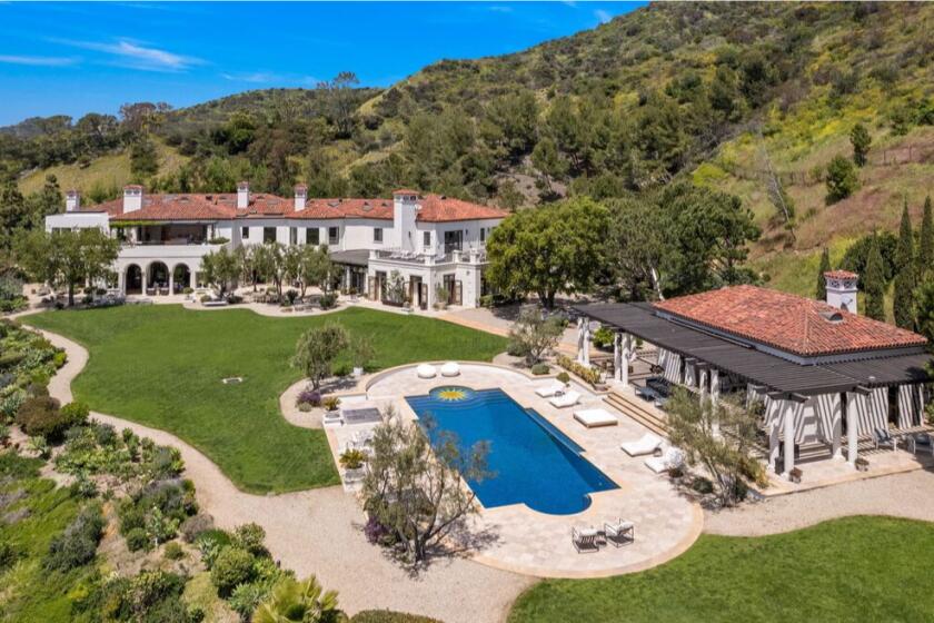 The Tuscan-style home holds 10 bedrooms and 22 bathrooms across three stories and 24,000 square feet.