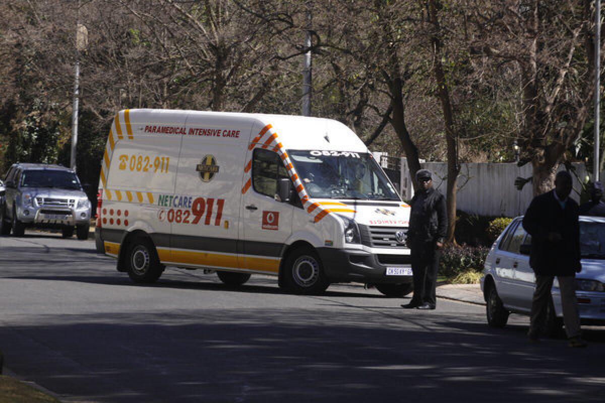 An ambulance carrying former South African president Nelson Mandela arrives at his home in Johannesburg, South Africa, on Sunday.