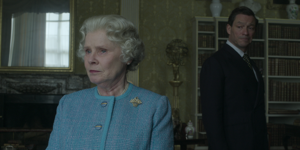 In a still image from "The Crown," Queen Elizabeth stands with her back turned to Prince Charles.