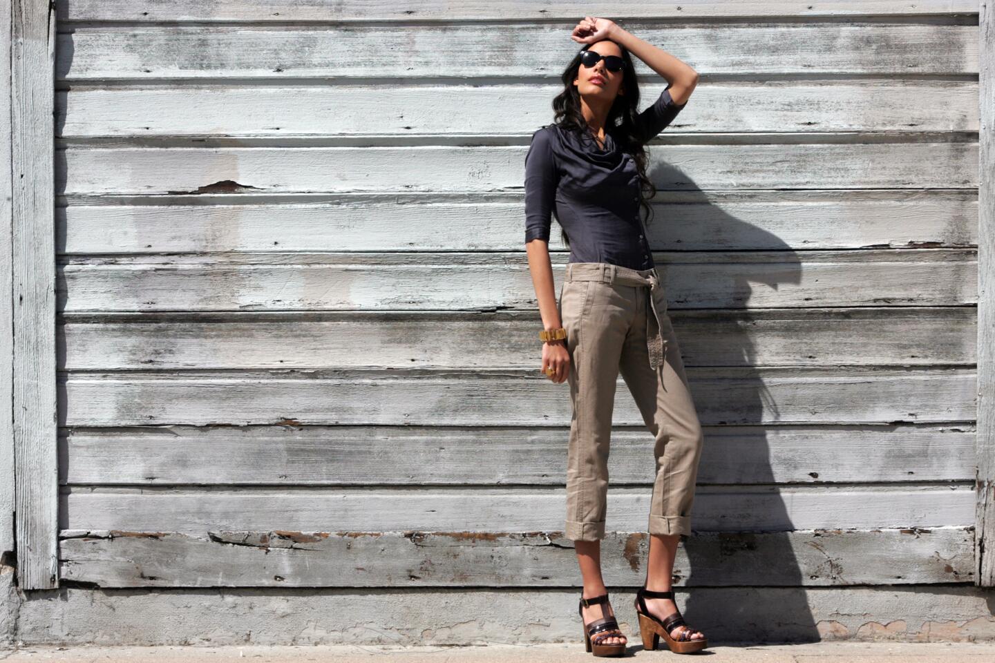 Helmut Lang shirt $255 at Helmut Lang, Melrose Ave., Banana Republic pants $69.50 at www.bananarepublic.com, Robert Clergerie shoes $690 at Barneys New York, Beverly Hills, CC Skye bracelet $175 and ring $125 at www.ccskye.com. All photographs shot by Bob Chamberlin / Los Angeles Times;  Styled by Melissa Magsaysay; Models: Nina Mansker and Cole Gerdes at Ford Models; Hair by Steve Mason; Makeup by Agostina both at Exclusive Artists Management