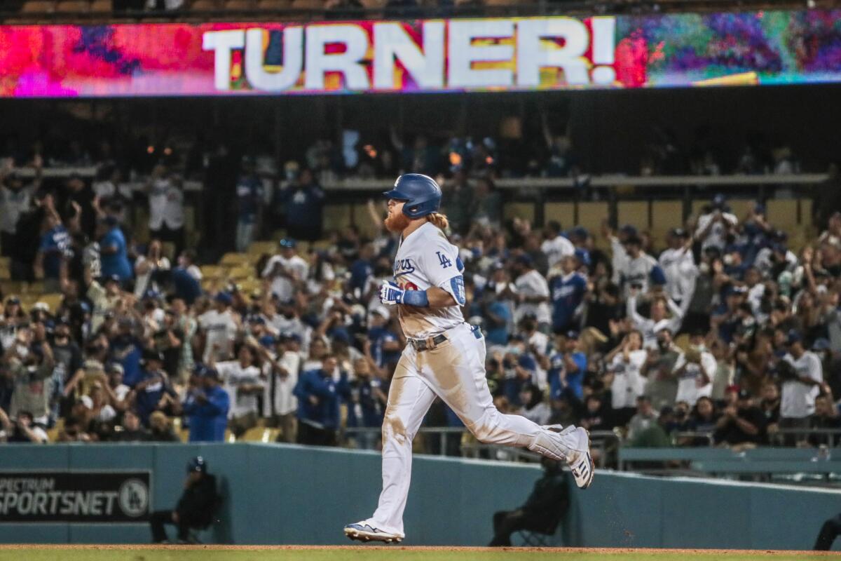 Dodgers third baseman Justin Turner runs the bases after hitting a solo home run.