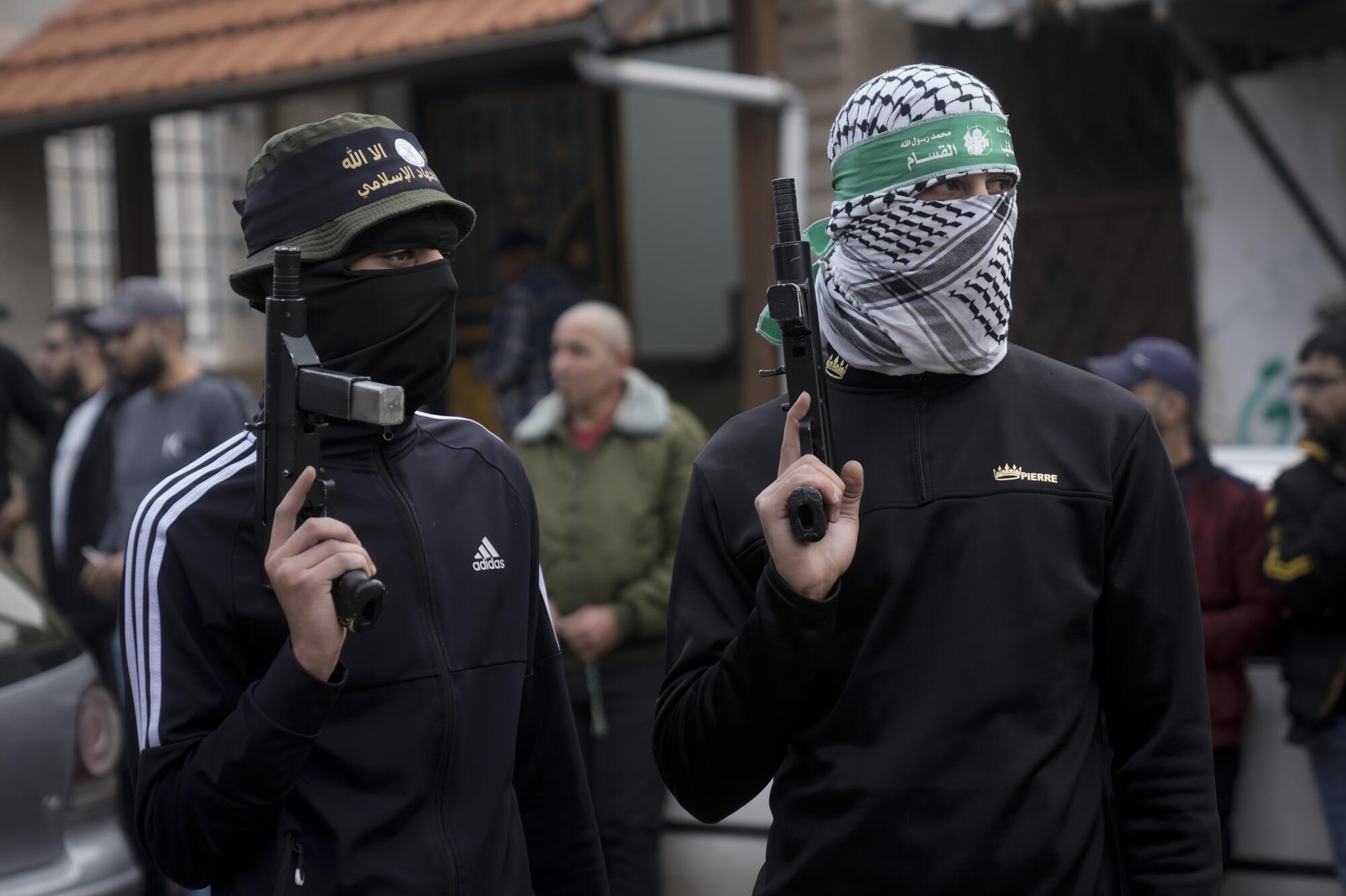 Palestinian gunmen at a funeral in the occupied West Bank
