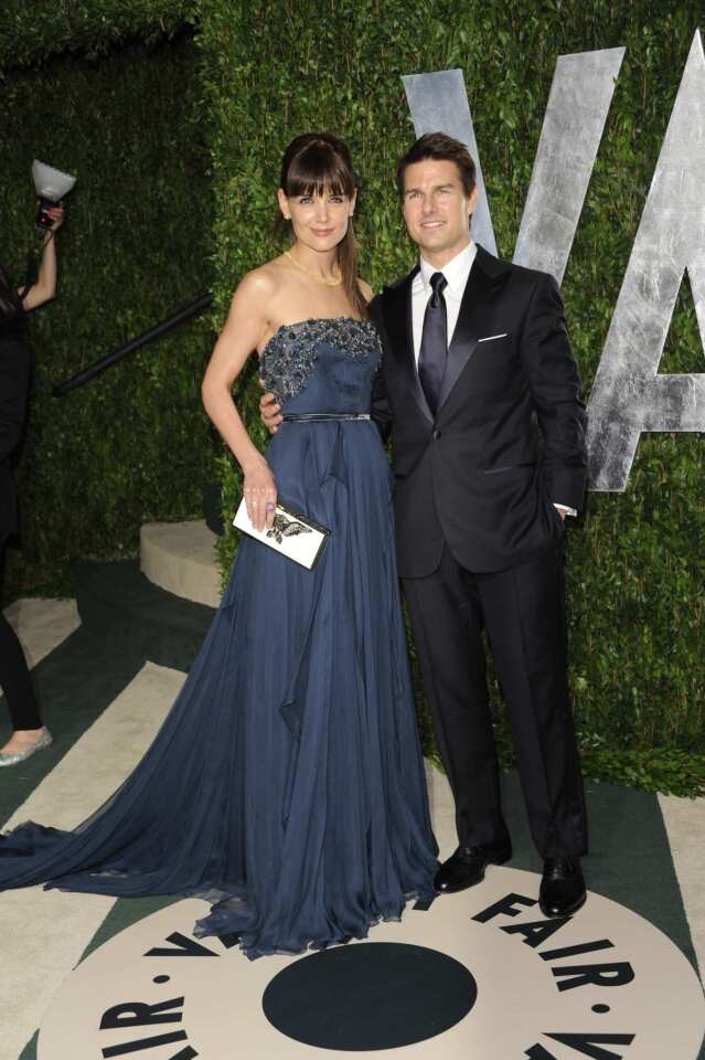 Katie Holmes, left, and husband Tom Cruise, who was a presenter at the awards.