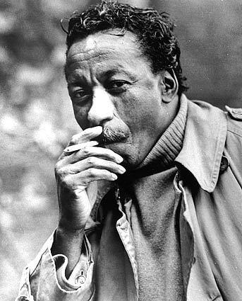 A 1966 photo shows photographer Gordon Parks, who captured the struggles and triumphs of black America as a photographer for Life magazine before becoming a Hollywood director.