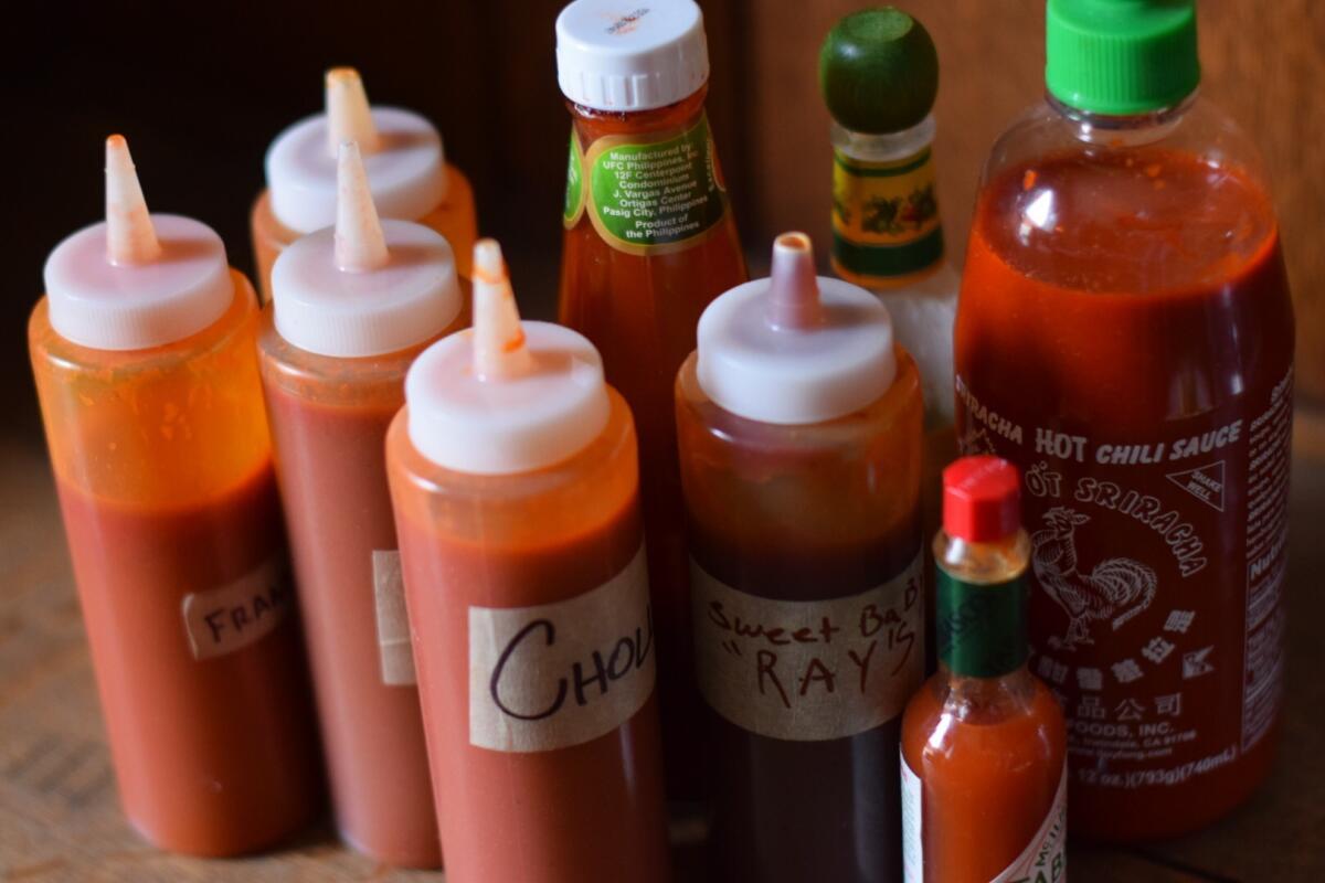 A variety of hot sauces are available with the fried chicken.