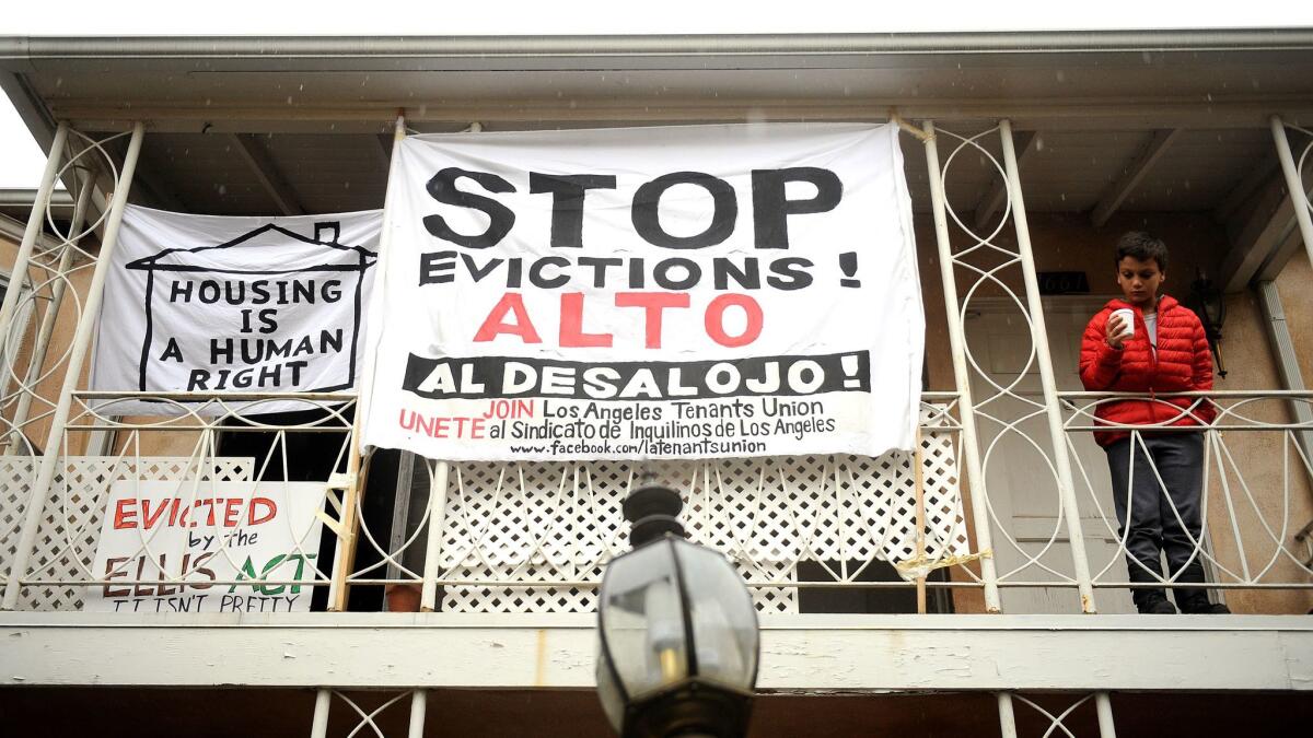 Anti-eviction signs decorate the Rodney Drive apartments in Los Feliz in 2016.