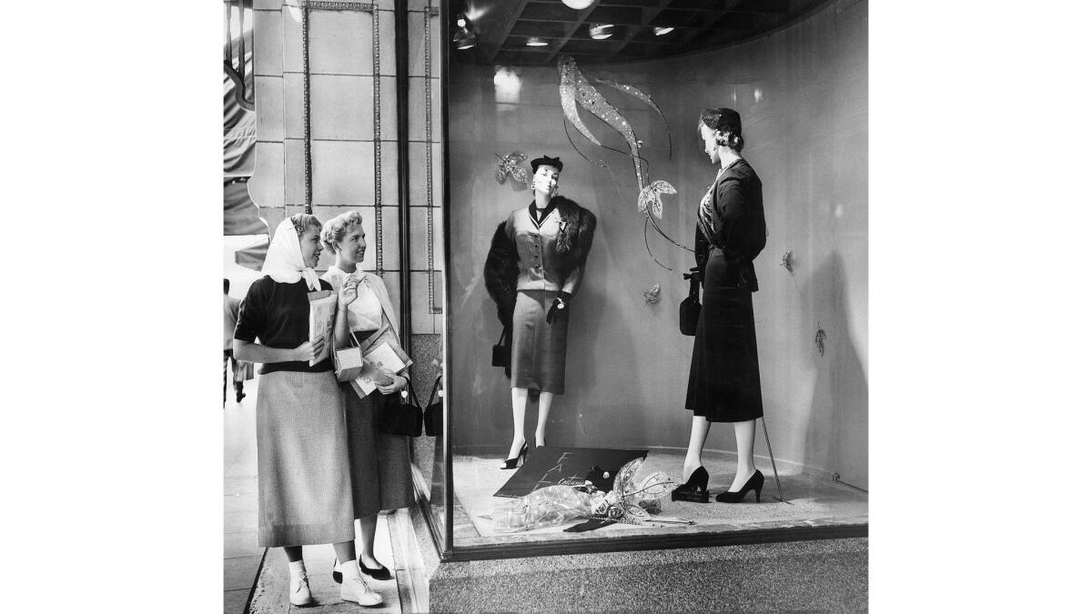 Sept. 17, 1953: Window shoppers Dolores Banke, left, and Evelyn Fuller study one of the window displays unveiled in downtown Los Angeles, presenting the new autumn fashions.
