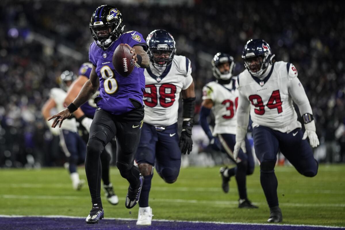 Baltimore Ravens quarterback Lamar Jackson runs into the end zone for a touchdown during a 34-10 win over the Houston Texas.