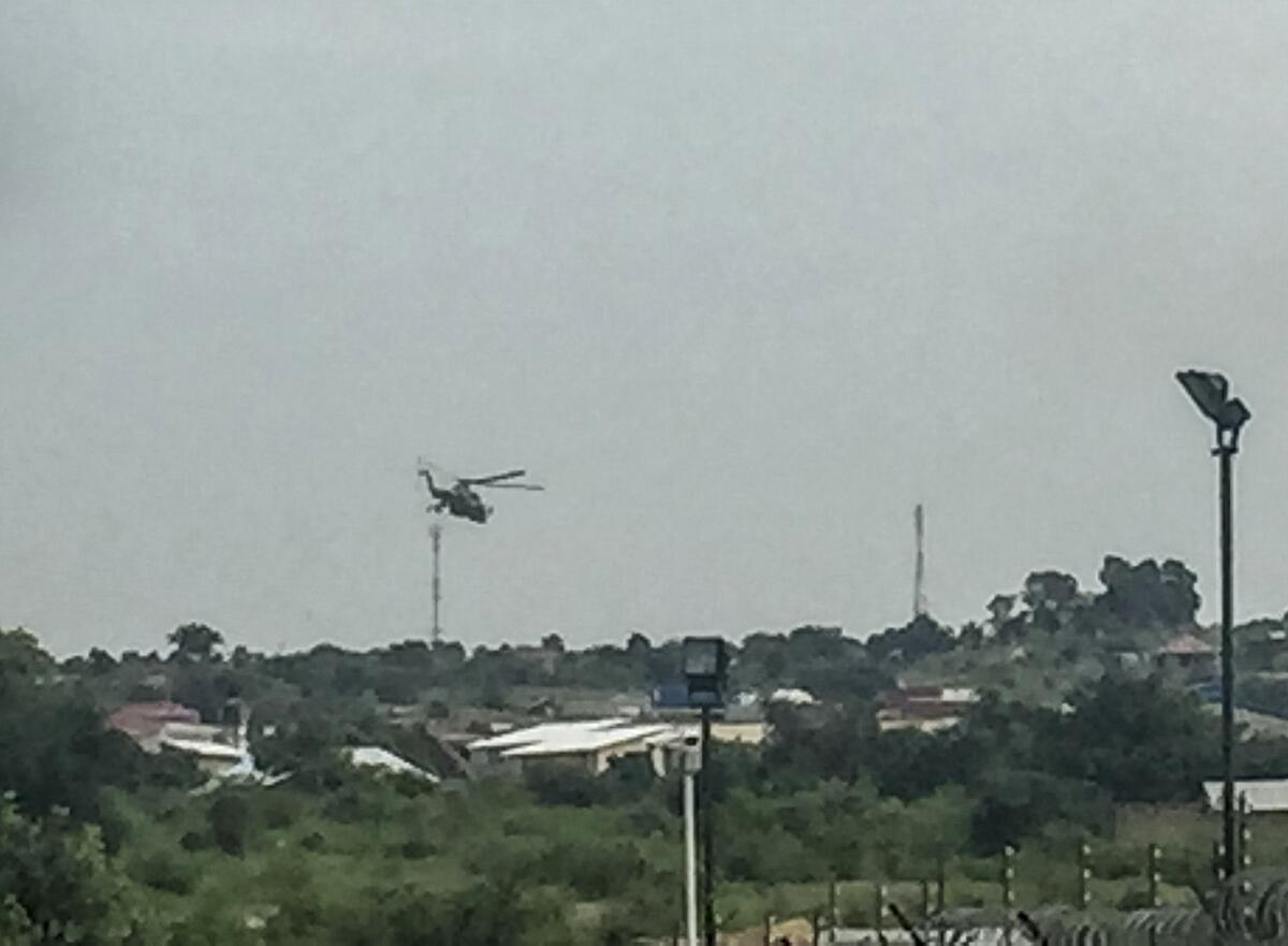 South Sudanese government attack helicopters hover over the the Jebel district of the capital, Juba, on July 11.