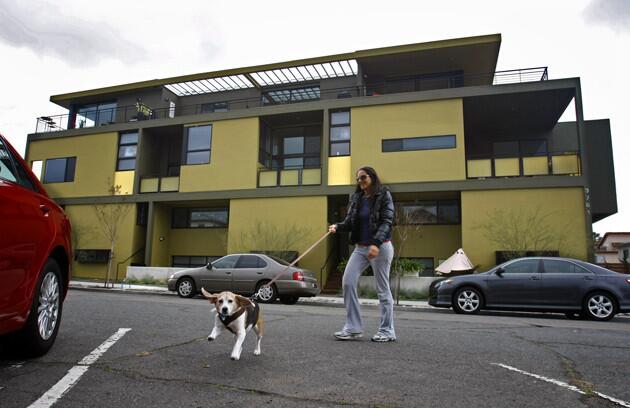 Jenny Cohen heads for her car in front of the Centre Street apartments. Behind her are hints of the abundant outdoor spaces worked into the plans. Said Bianca Pettis, an artist from Minnesota who qualified for one of the low-income units (monthly rent: $750): "We couldn't get anything like this in Minneapolis." More photo tours: Southern California homes and gardens Our blog: L.A. at Home