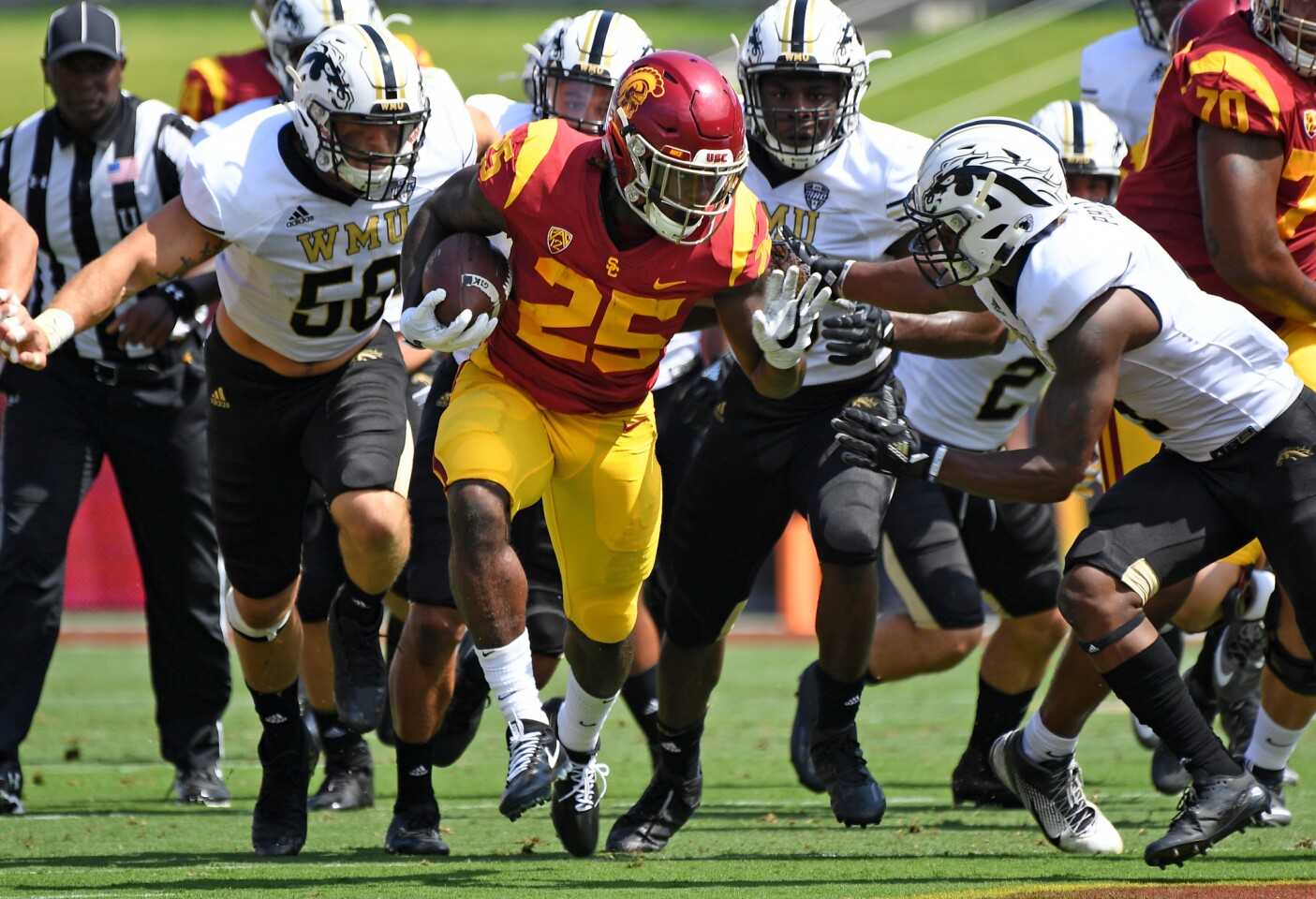 USC running back Ronald Jones II picks uo big yards against the Western Michigan defense during the first quarter at the Coliseum.