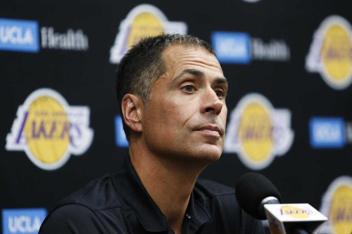 Rob Pelinka listens to a question from a reporter during the Lakers' media day.