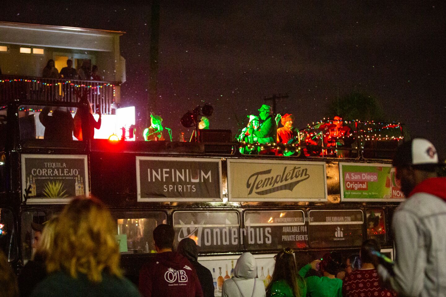 Musicians play atop the Wonderbus during the Ocean Beach Holiday Parade.