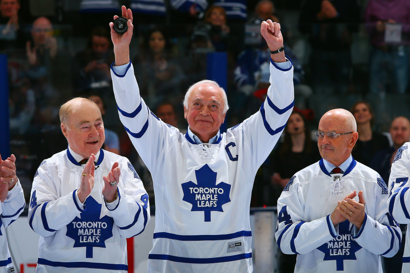 TORONTO, ON - FEBRUARY 8: Former Leafs Captain George Armstrong waves to the crowd beside.