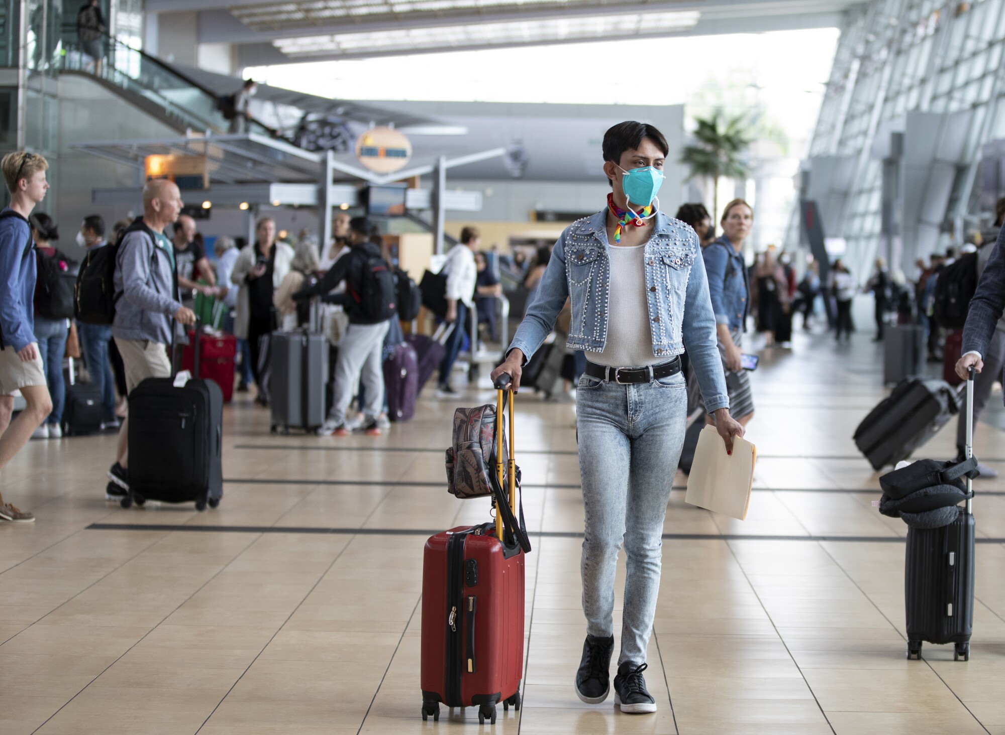 Zethare walks to her gate at the San Diego International Airport en route to New York City.