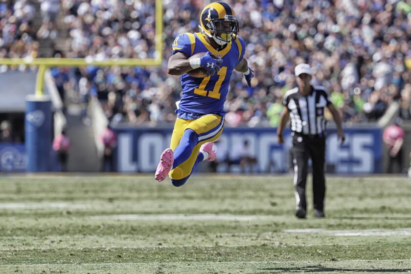 Rams receiver Tavon Austin turns the corner on an end around sweep during third quarter action against the Seahawks.