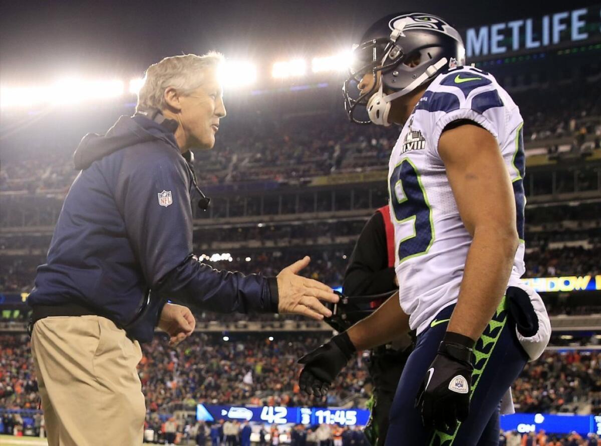Head coach Pete Carroll of the Seattle Seahawks celebrates with wide receiver Doug Baldwin during Super Bowl XLVIII on Sunday.