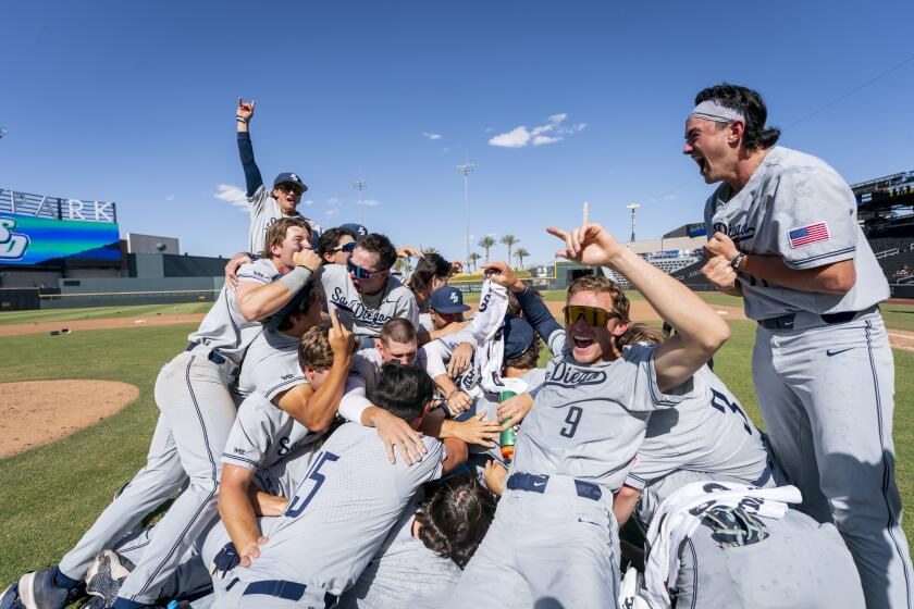 USD players ceebrate winning the West Coast Conference Tournament title game on Saturday.