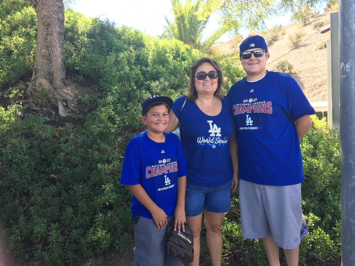 Gaby Baez with her nephew, Ricky Martinez, left, and son, Edward LaFouge.