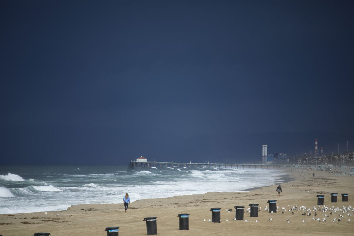Storm clouds move ashore over Hermosa Beach.
