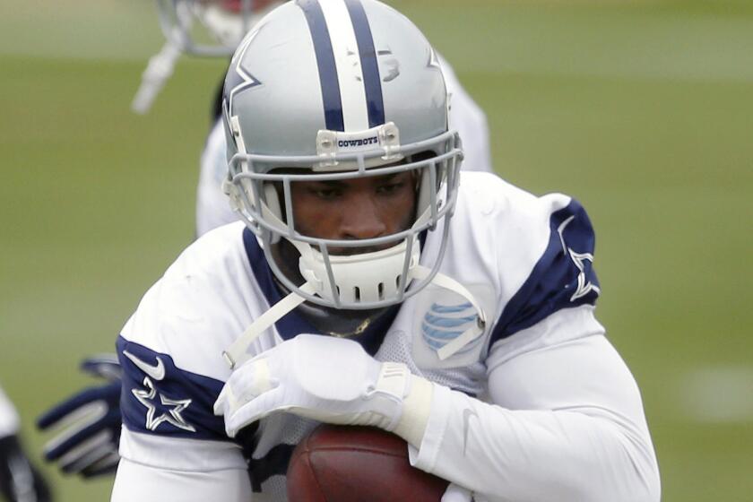 Dallas Cowboys running back DeMarco Murray carries the ball during drills at the team's practice facility in Irving, Texas, on Wednesday, two days after surgery to repair a broken bone in his left hand.