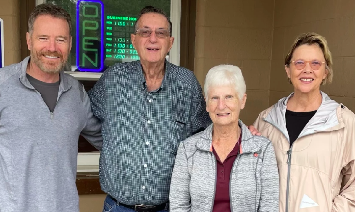 Four people pose for a photo