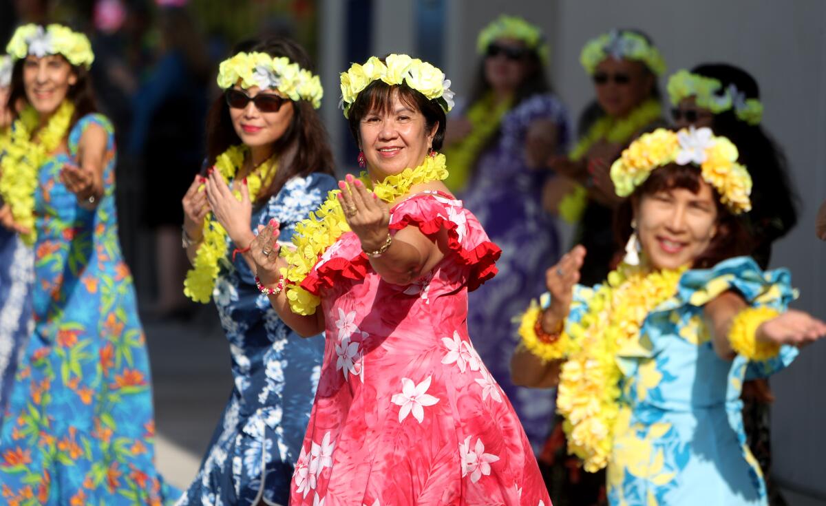 Luz Camei, center, and the rest of the Na Kapua O Jocelyn dance group perform a Hawaiian dance for seniors in attendance at the annual Rock-a-Hula, held at the Verdugo Aquatic Center in Burbank on Thursday, Sept. 19, 2019.