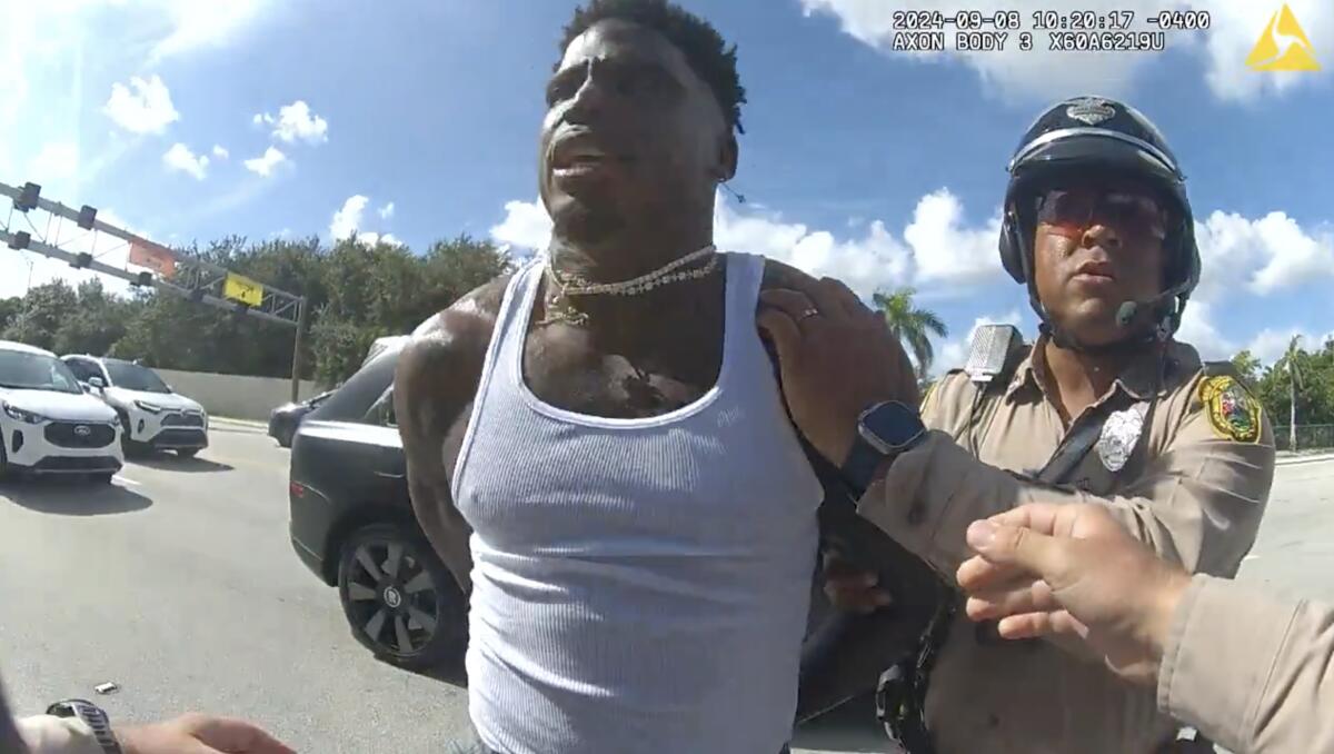 Body-cam footage shows Miami-Dade police officers handcuffing Dolphins receiver Tyreek Hill