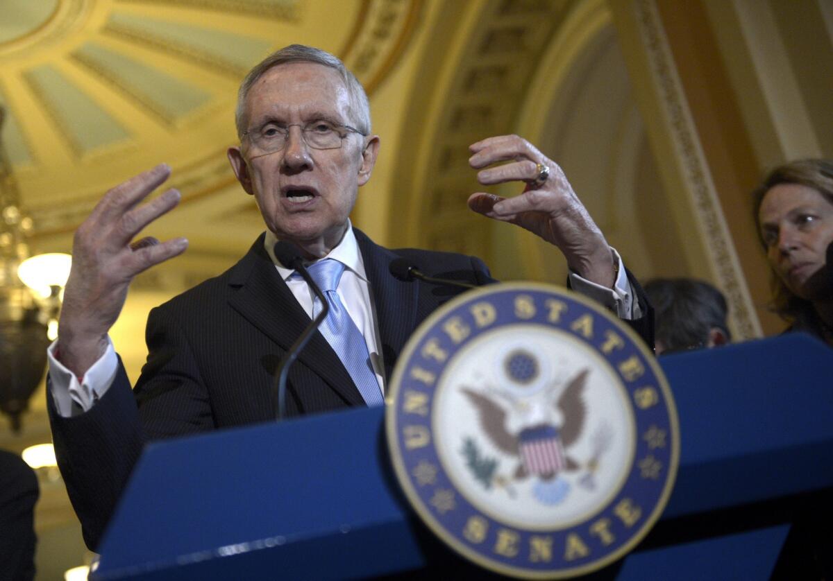 Senate Majority Leader Harry Reid (D-Nev.) responds to a question during a news conference in Washington on Tuesday.