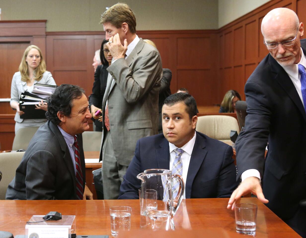 Jury consultant Robert Hirschhorn ( left) with defense attorney Mark O'Mara (standing), defendant George Zimmerman, and co-counsel Don West (right) during a recess in Seminole circuit court on the 2nd day of Zimmerman's trial, in Sanford, Fla., Tuesday, June 11, 2013. Zimmerman is accused in the fatal shooting of Trayvon Martin. (Joe Burbank/Orlando Sentinel) newsgate CCI B582986525Z.1