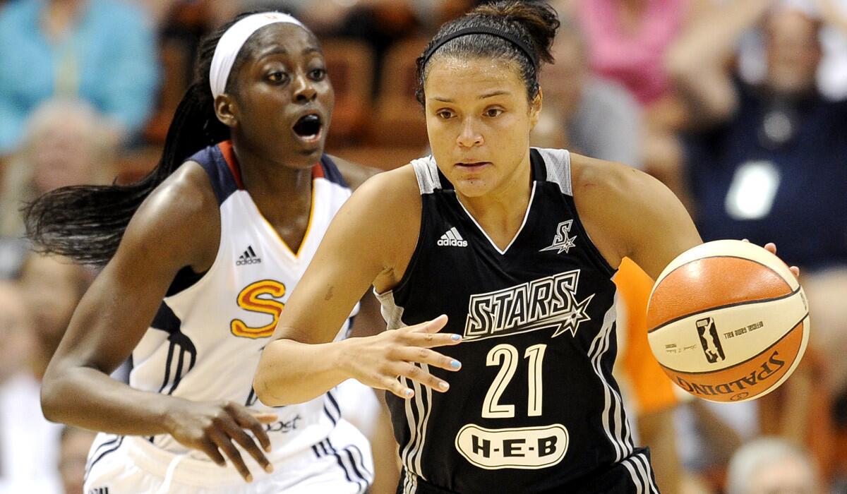 Stars guard Kayla McBride, driving against Connecticut Sun's Chiney Ogwumike during a game earlier this season, scored 21 points against the Sparks on Sunday.