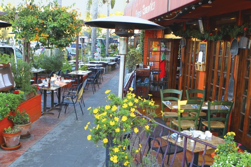 Patio dining and tables along the sidewalk provide European panache at Osteria Romantica in La Jolla. Photo by Daniel K. Lew