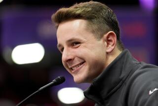 San Francisco 49ers quarterback Brock Purdy smiles while speaking to reporters during Super Bowl Opening Night.