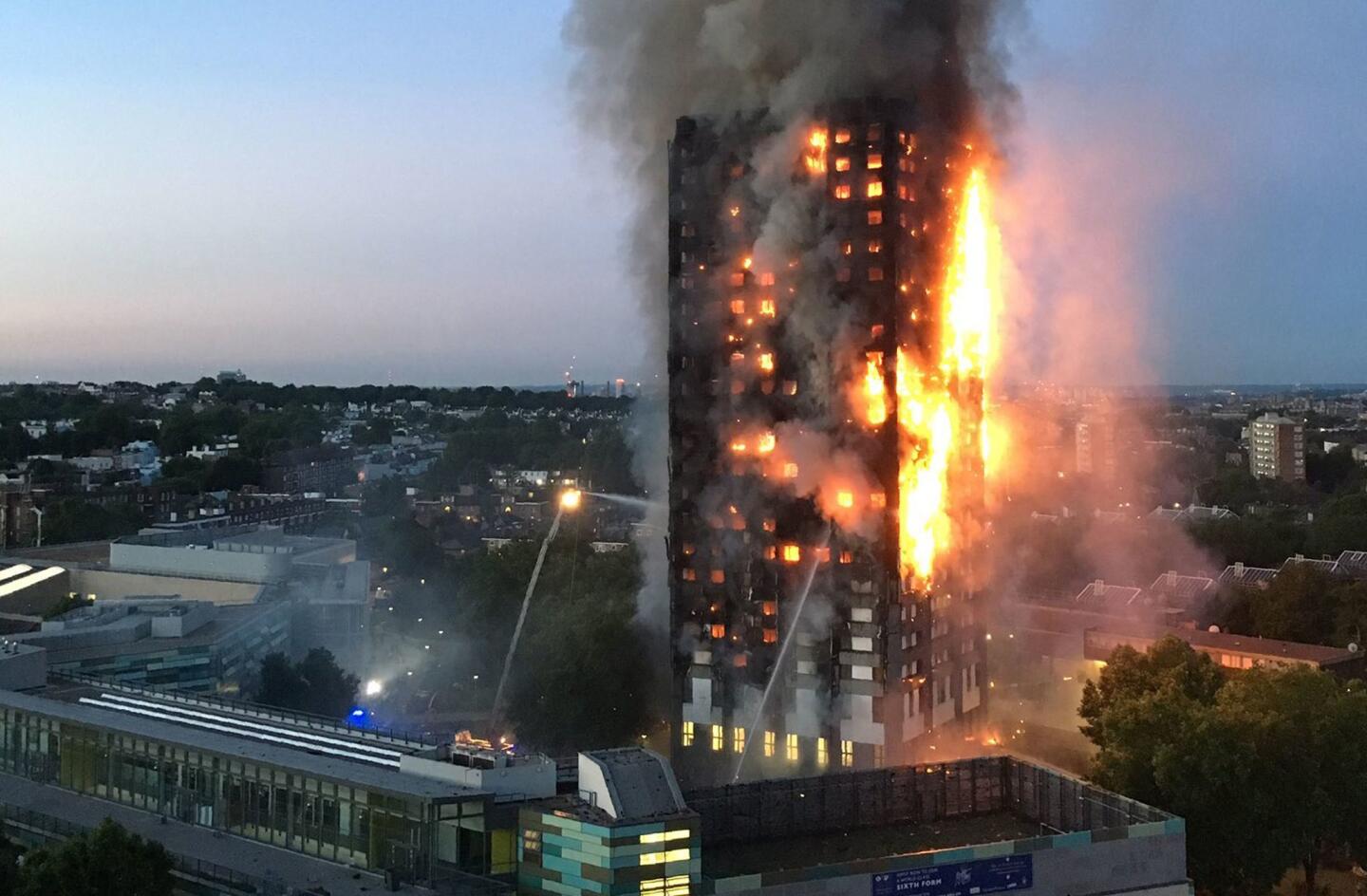 Flames and smoke pour from a high-rise apartment tower in London where several died June 14, 2017.