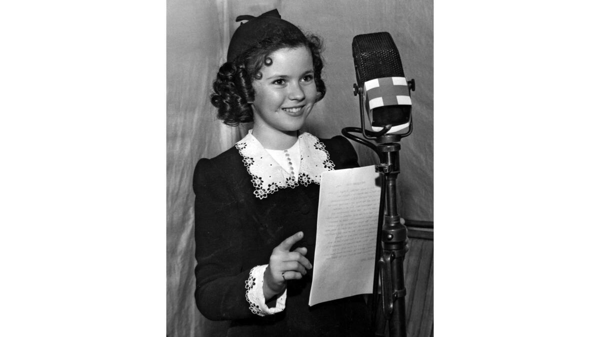 June 22, 1940: Actress Shirley Temple appears at a two-hour nationwide radio benefit for the American Red Cross Mercy Fund.
