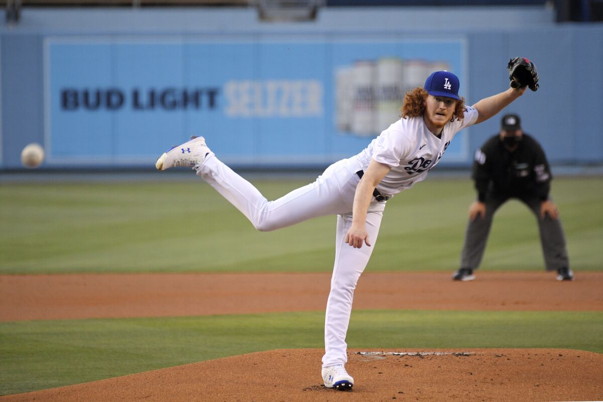 Los Angeles Dodgers starting pitcher Dustin May throws to the plate.