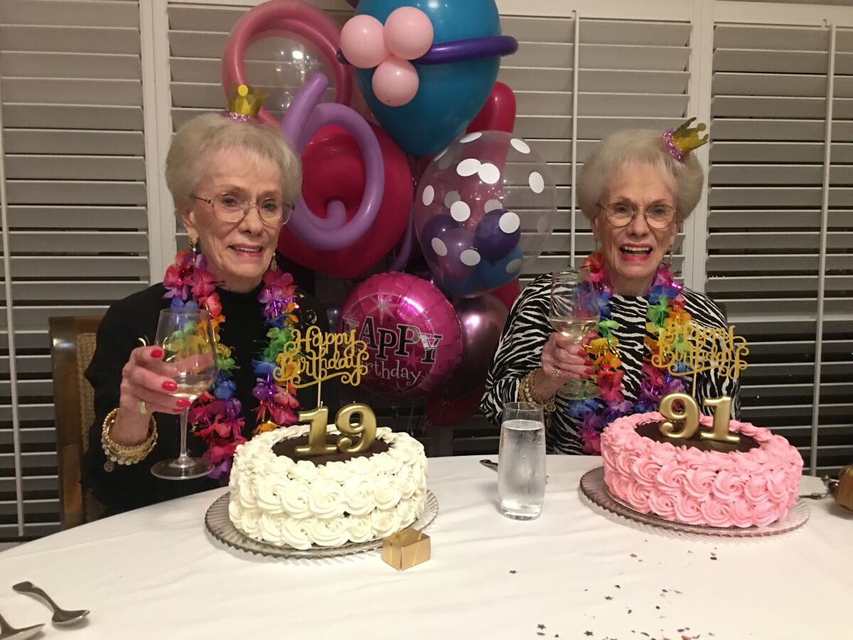 Identical twins Joyce Kriesmer and Jackie Voskamp at their 91th birthday party on March 1, 2020.