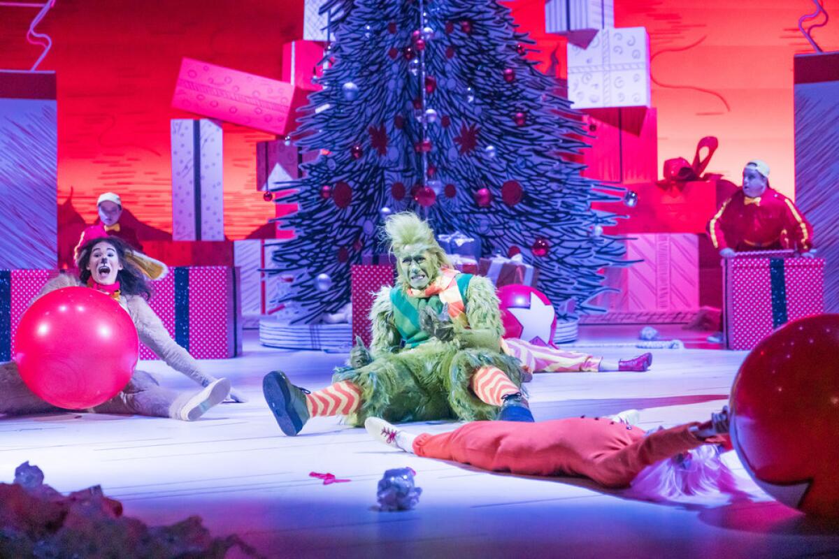 Booboo Stewart as Young Max with Matthew Morrison as Grinch onstage in "Dr. Seuss' The Grinch Musical!"
