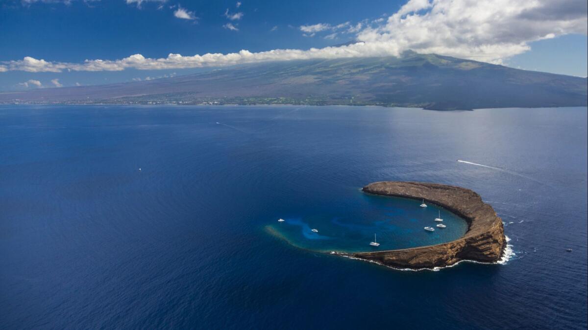 The popular snorkeling and diving spot of Molokini Crater.