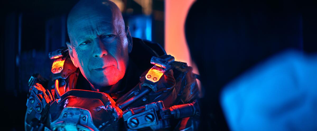 Bruce Willis wears a metal-covered space suit in the movie 'Cosmic Sin'